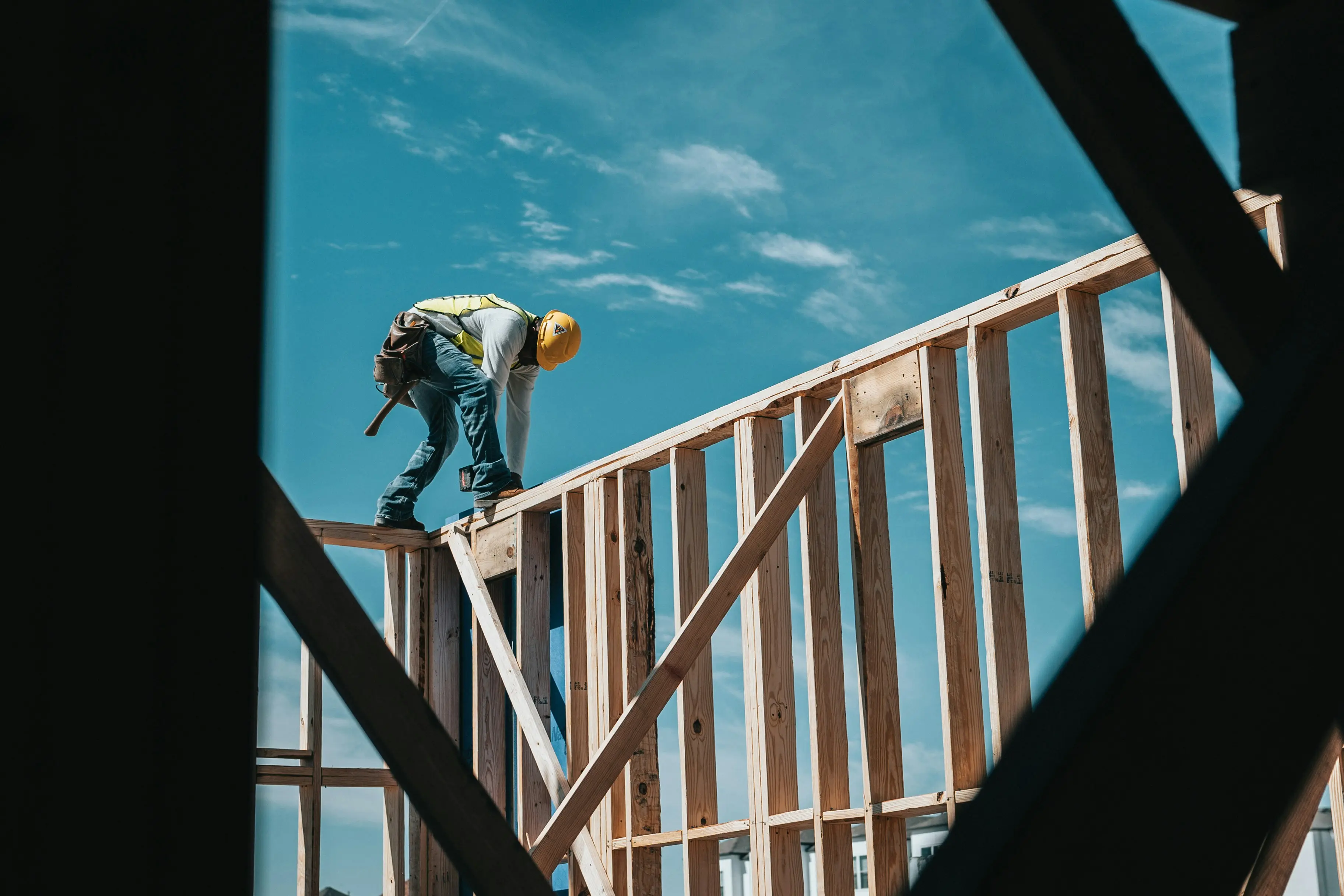 Construction worker framing a new home