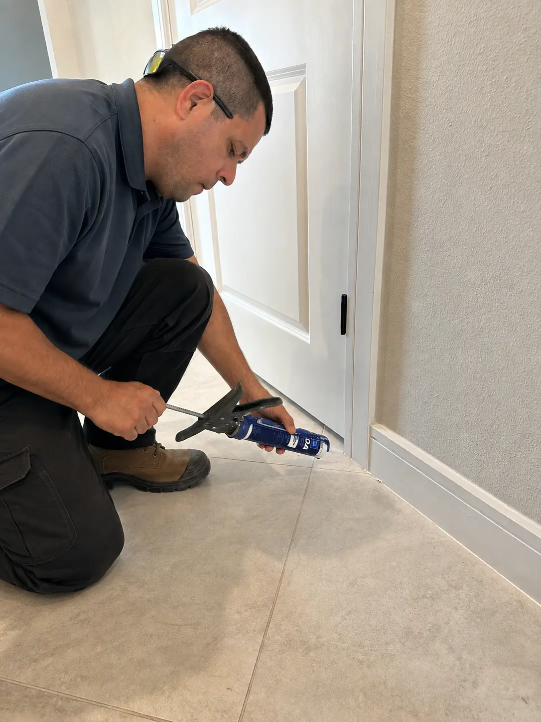 A finished interior showcasing professional drywall, painting, trim, and flooring work