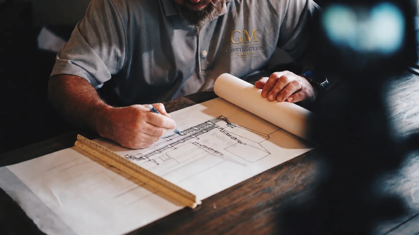 An architect and general contractor reviewing construction plans
